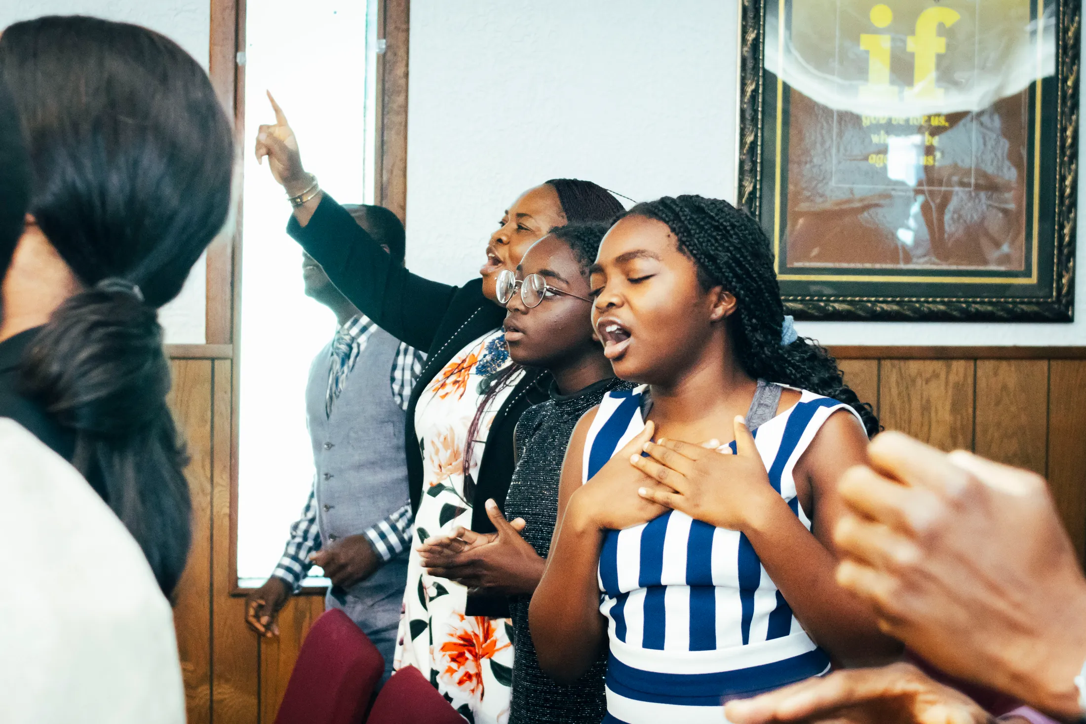 Victory House members worshipping together